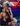 Blonde girl holding white game controller.